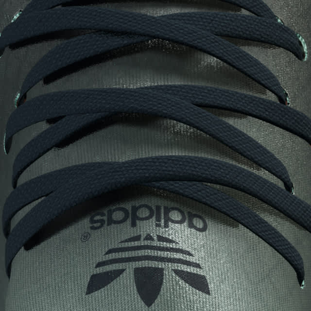 Adidas Deerupt close up of black laces and green tongue