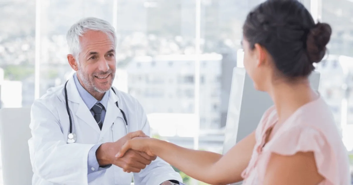 doctor shaking hand with patient