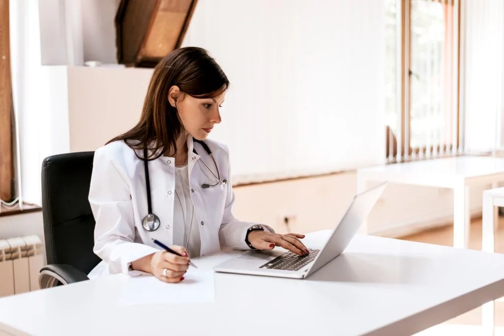 doctor working on laptop