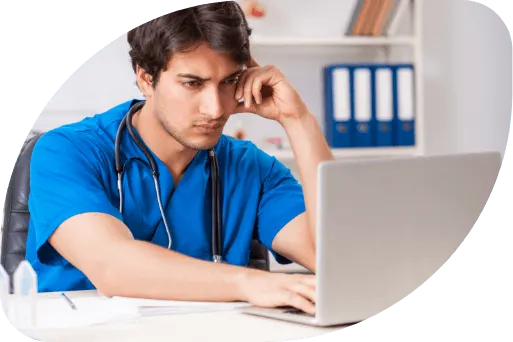 Doctor working on laptop