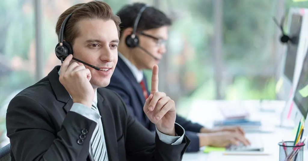 Call center rep talking to a patient on the phone