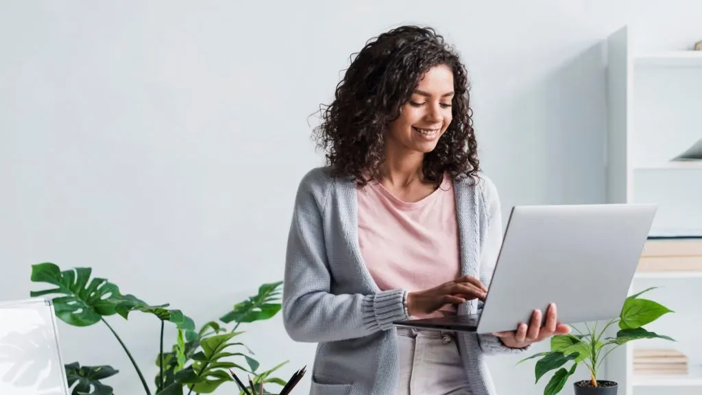 women hoolding laptop