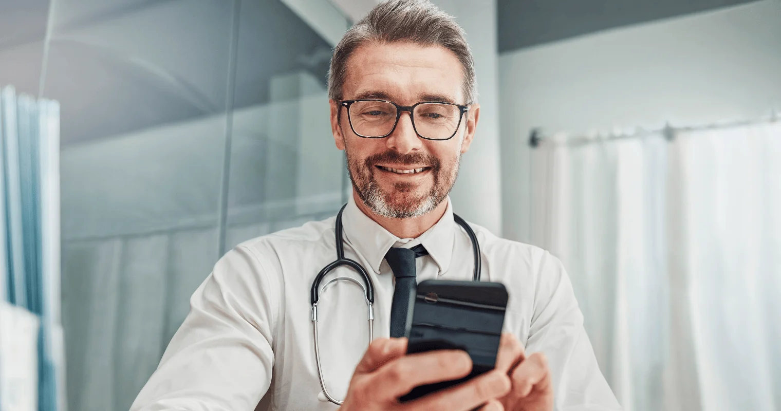 HCP Doctor using mobile phone to text