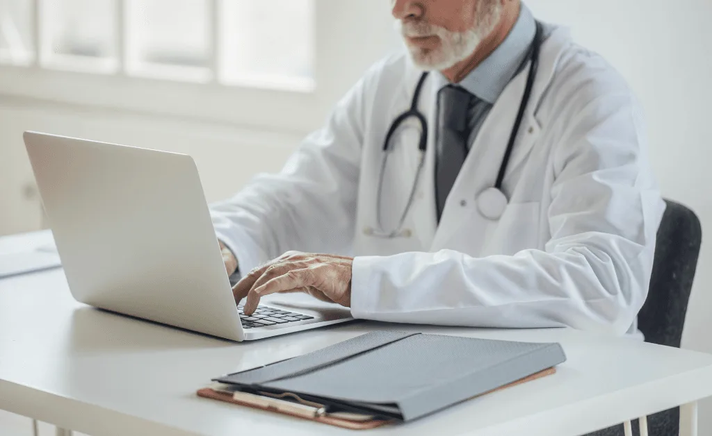 doctor working on laptop