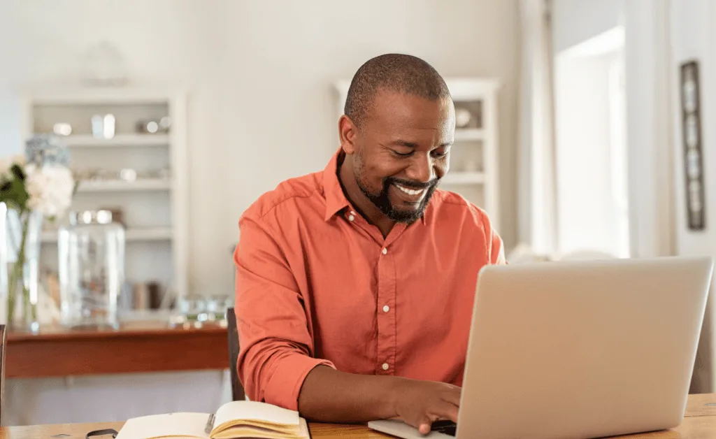 happy pharma sales rep using laptop