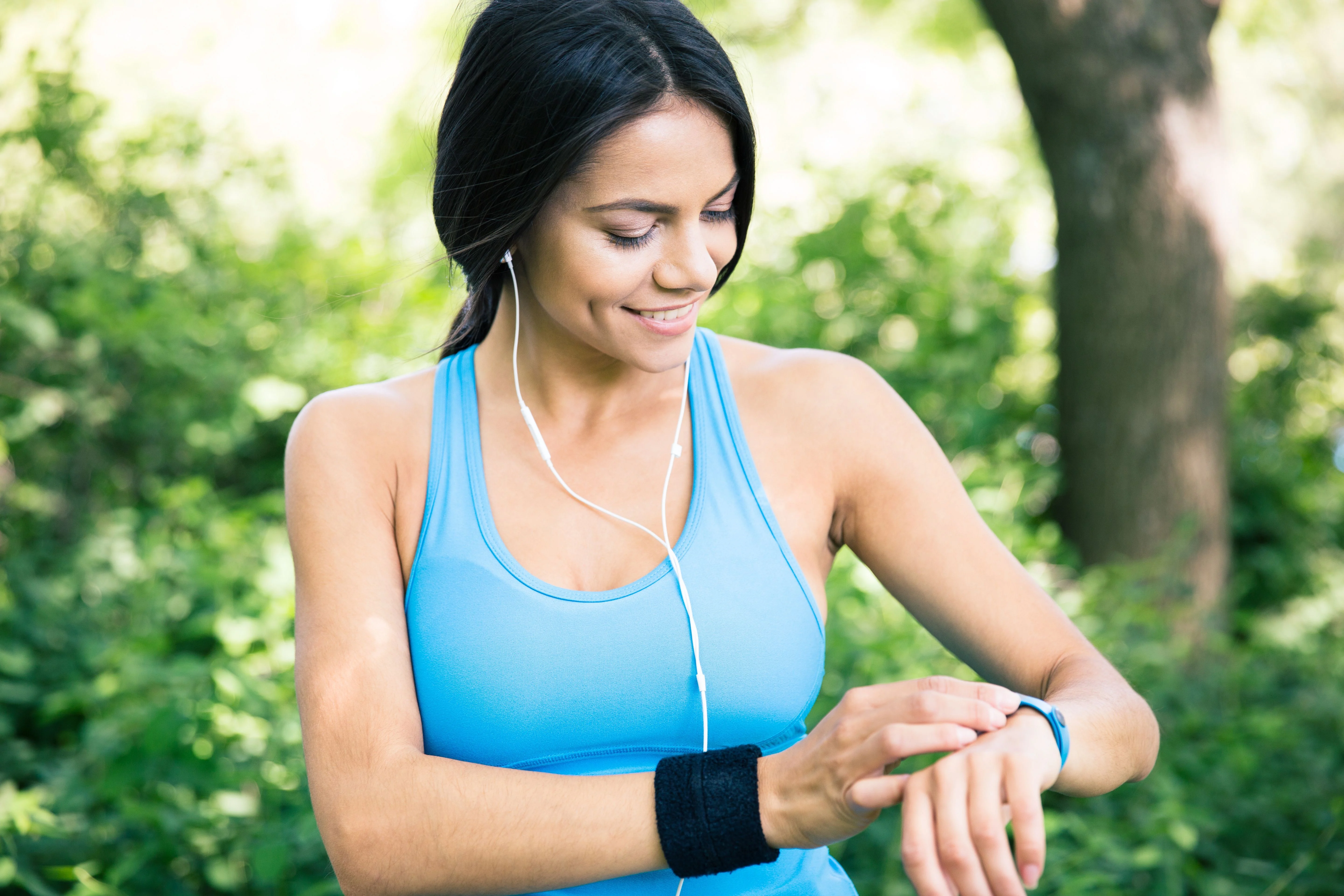 woman using digital smartwatch