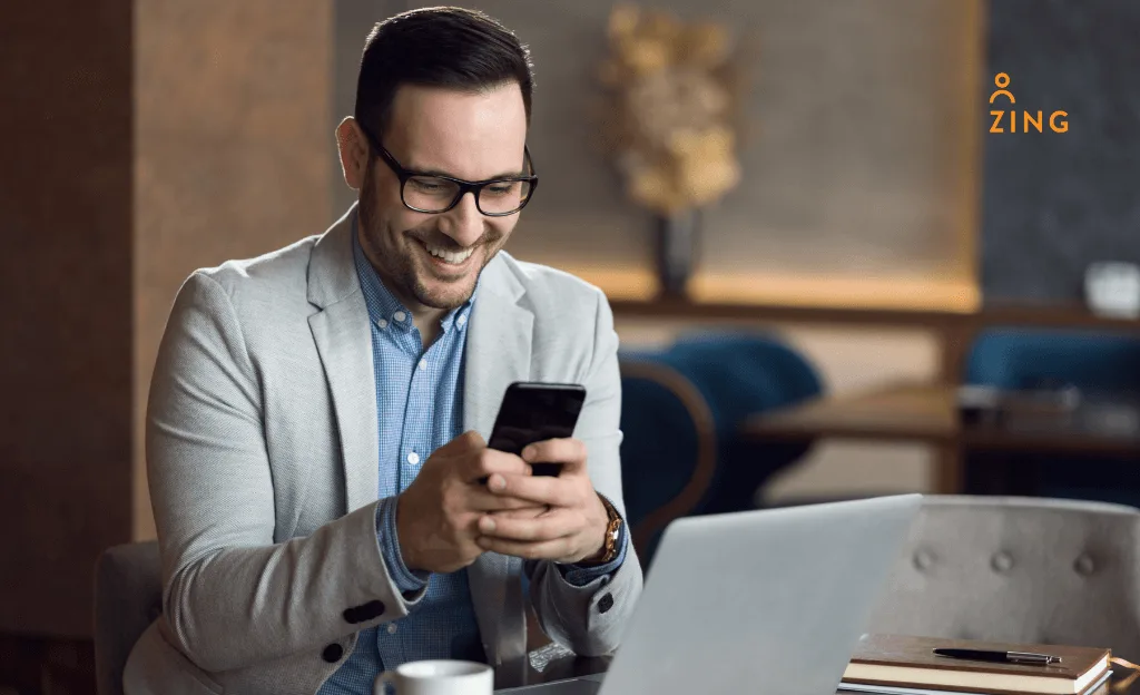 happy man holding mobile