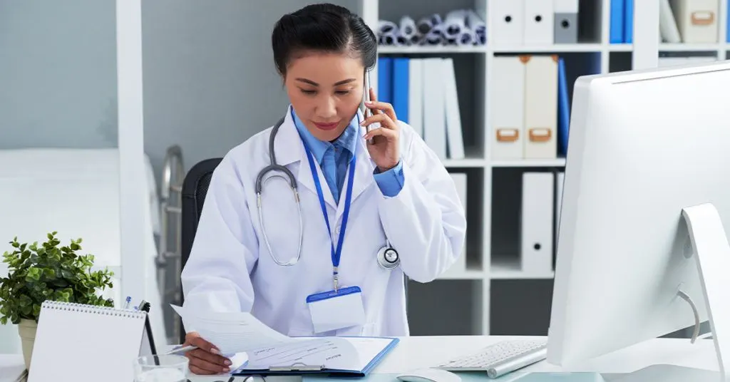 Physician communicating with a pharma sales rep