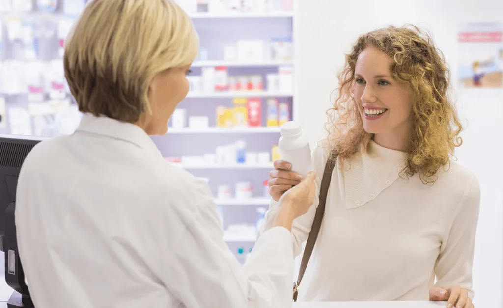 pharmacist and customer discussing a product