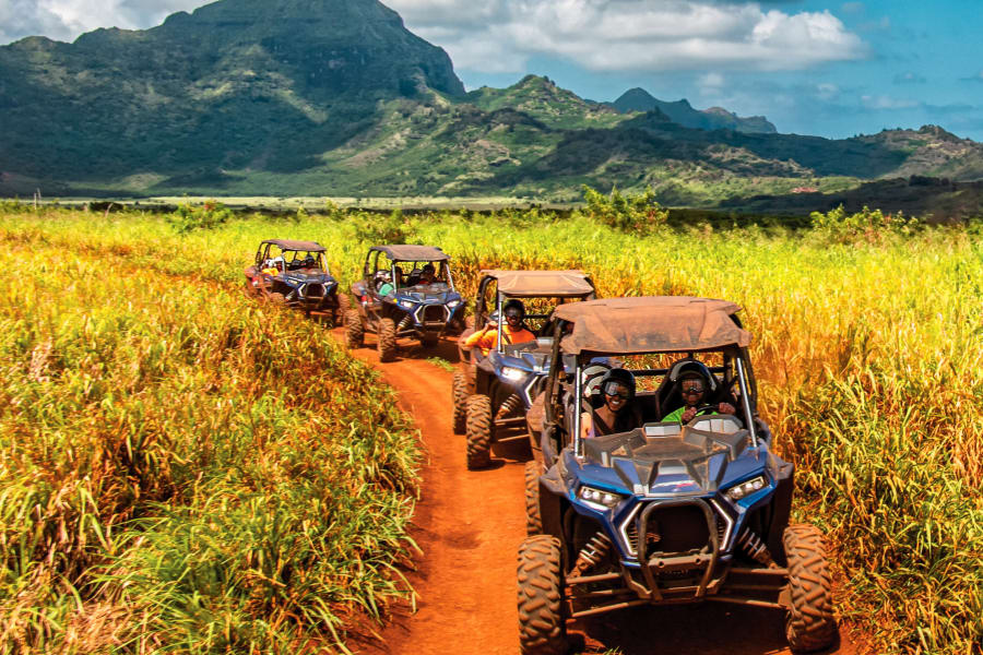 group of riders on Polaris RZRs