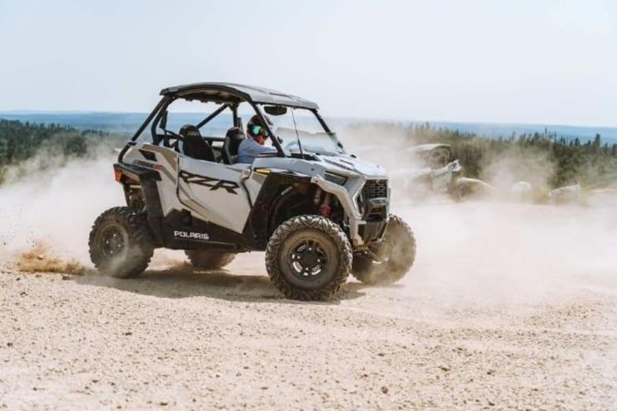 Polaris RZR on dusty, rocky ground