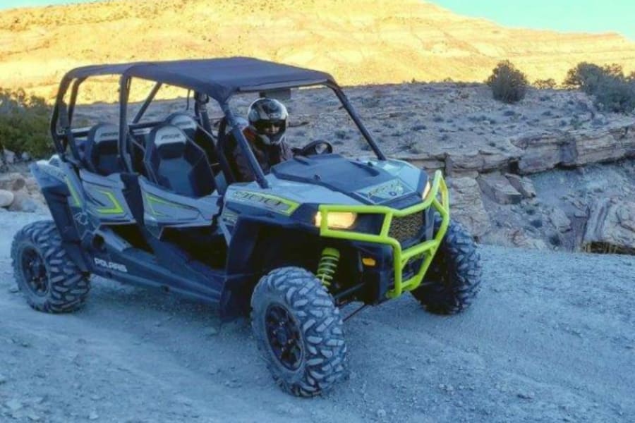 Two people in Polaris RZR side by side