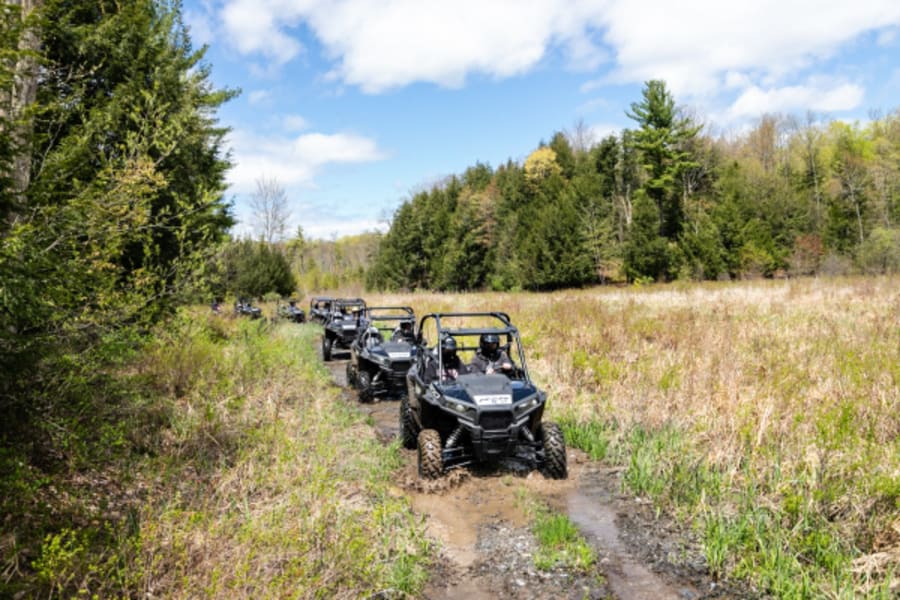 Polaris ORVs driving in a row