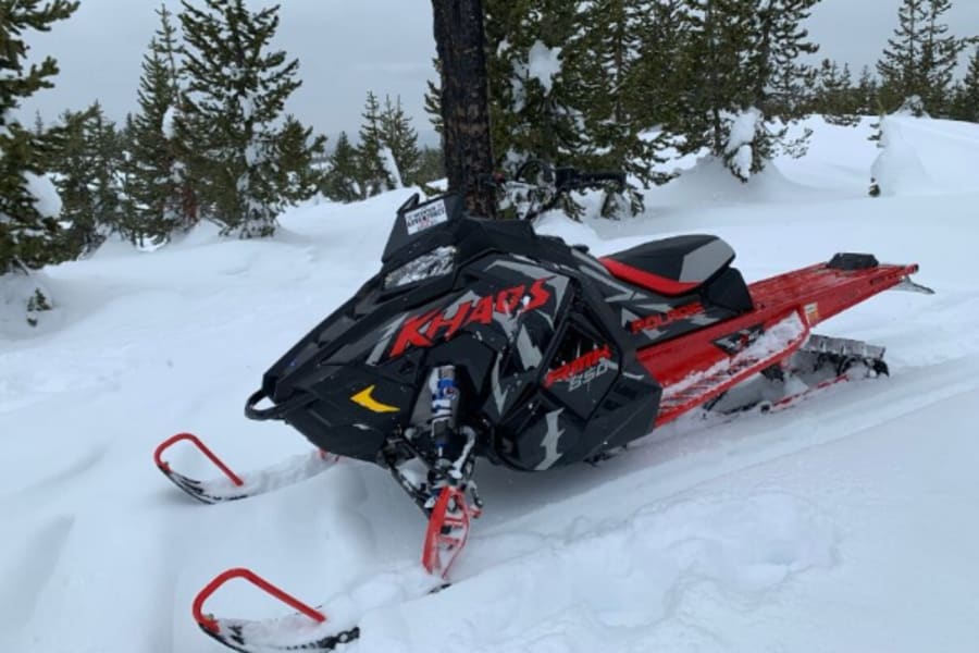 Red Polaris snowmobile