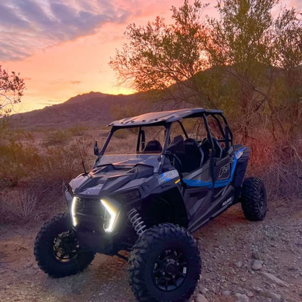 Polaris RZR at sunset in desert