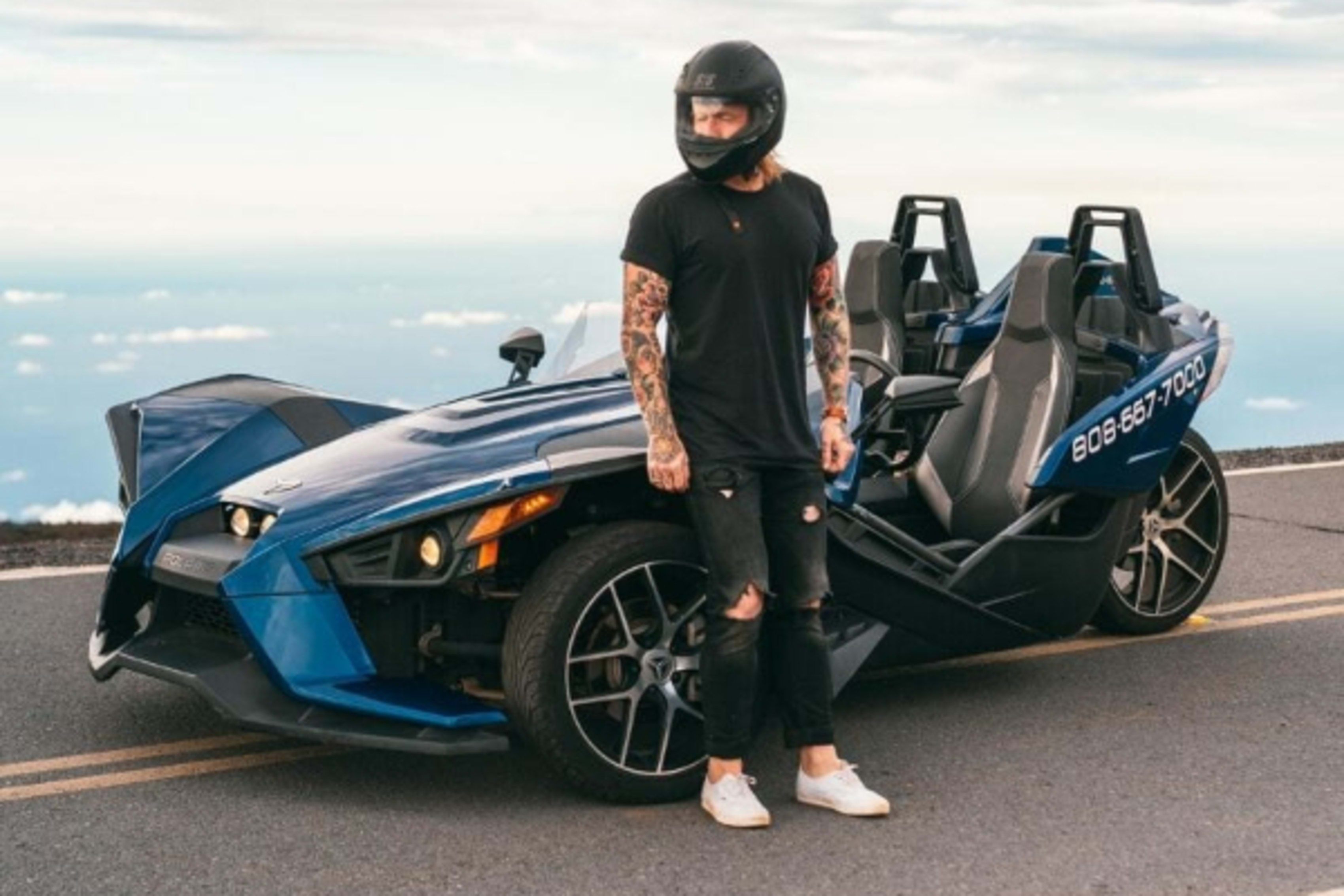 Man standing by Polaris Slingshot