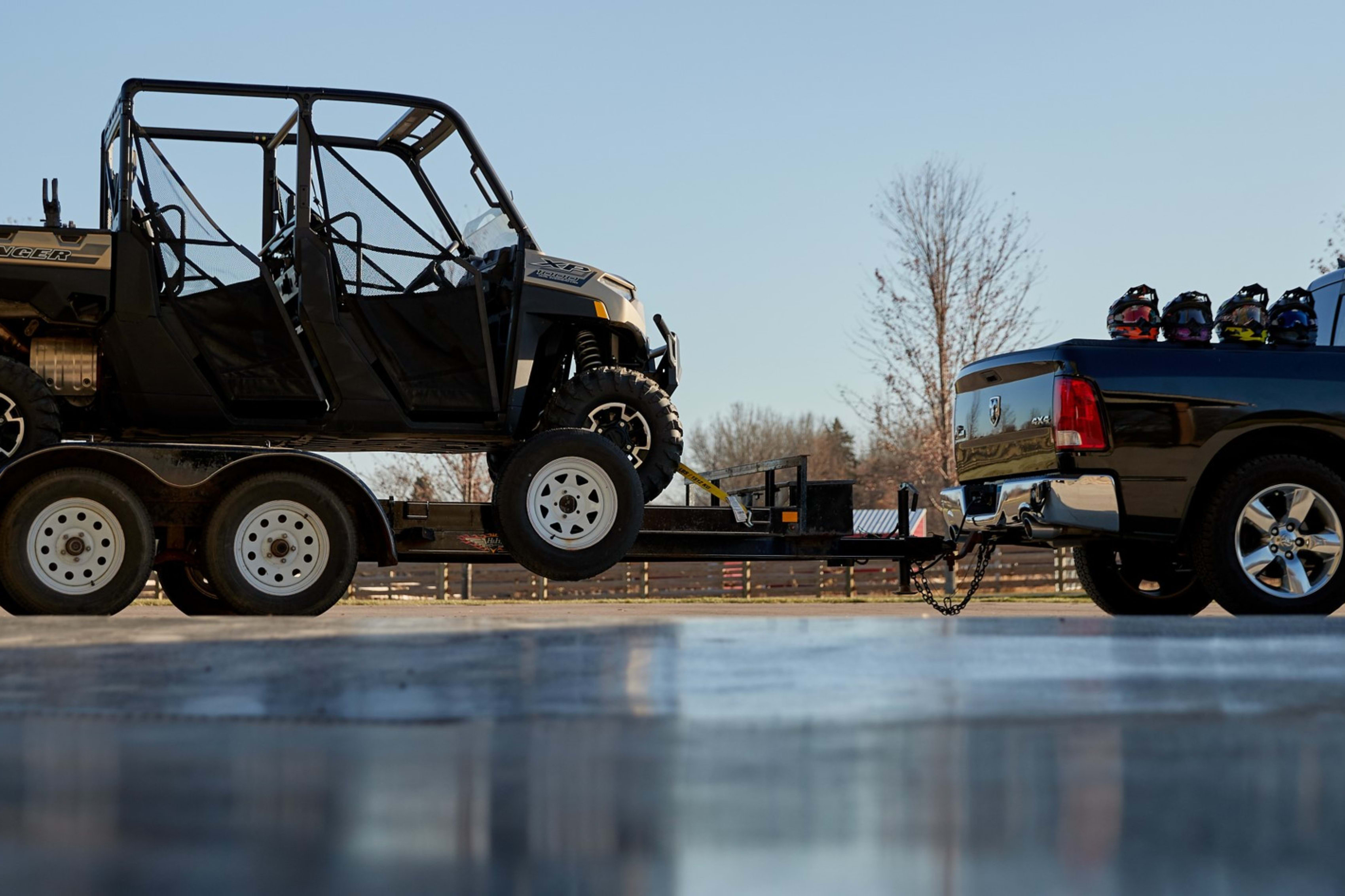 Pickup and trailer hauling Polaris off-road vehicle