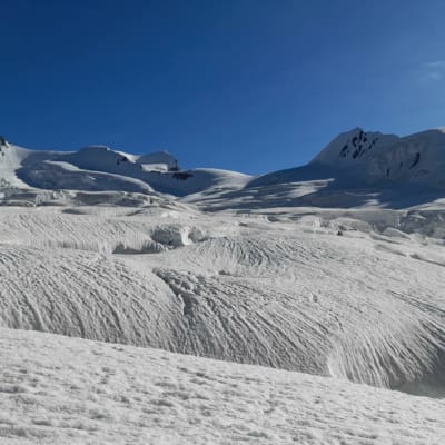 snow covered mountain on snow lake trek