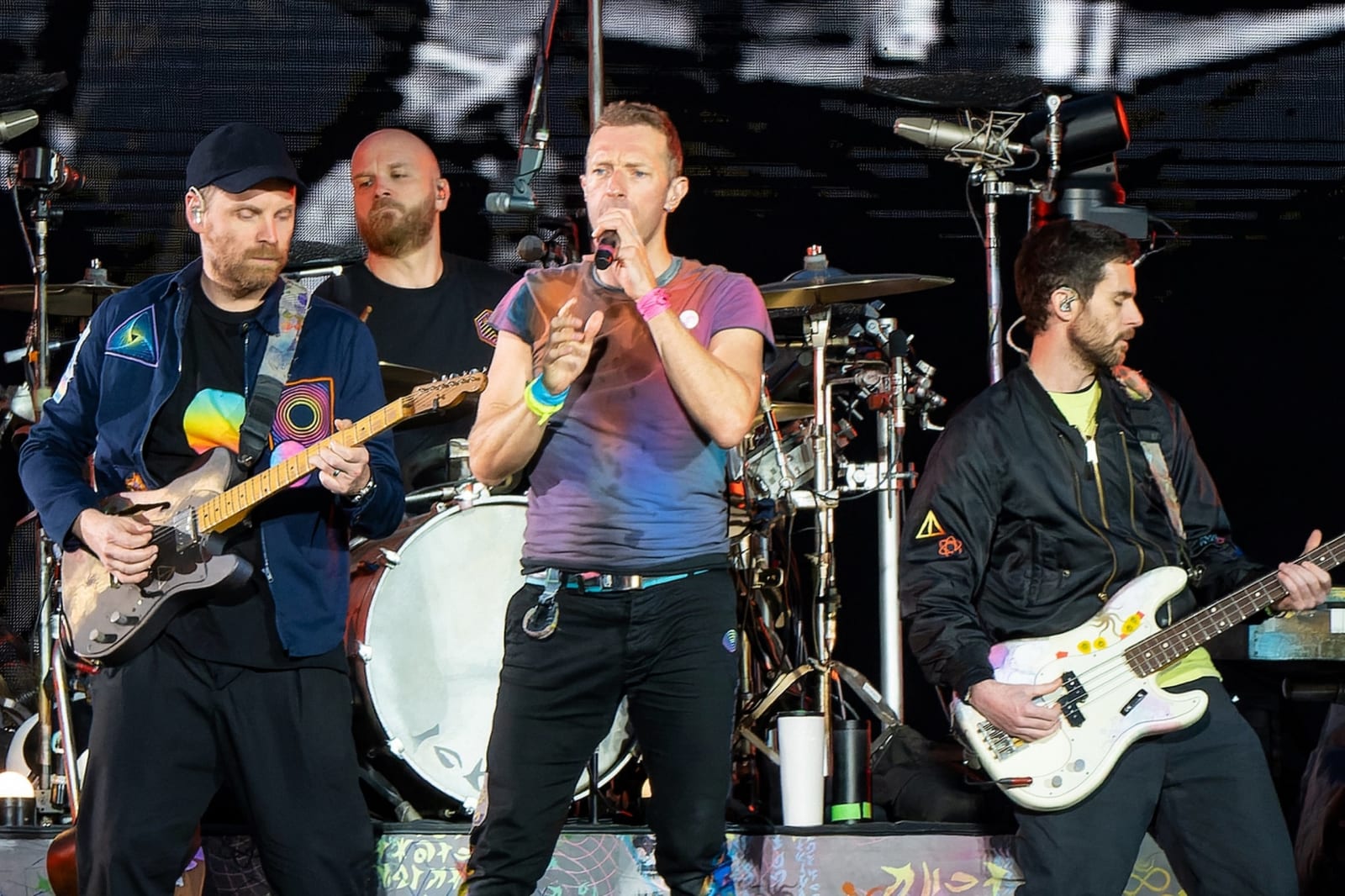Coldplay performing live on stage — the Music of the Spheres tour, produced in India by BookMyShow Live