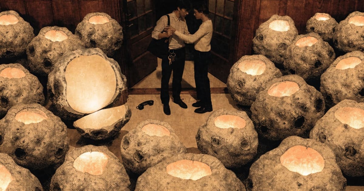 A couple reconnects in an entryway scattered with sunchokes glowing like small earthen lanterns, keys and a phone left untouched.
