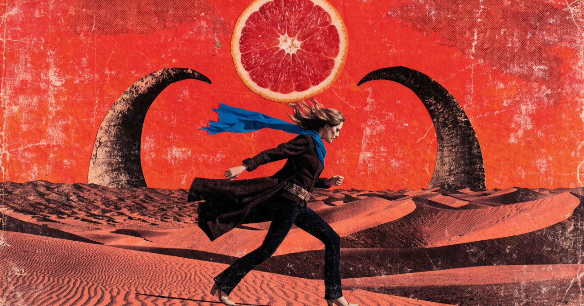 A woman strides through a scorched red desert beneath a sun made of a halved blood orange, ram's horns rising behind