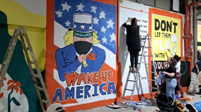 אמנות רחוב וגרפיטי בחיפה בעקבות חרבות ברזל