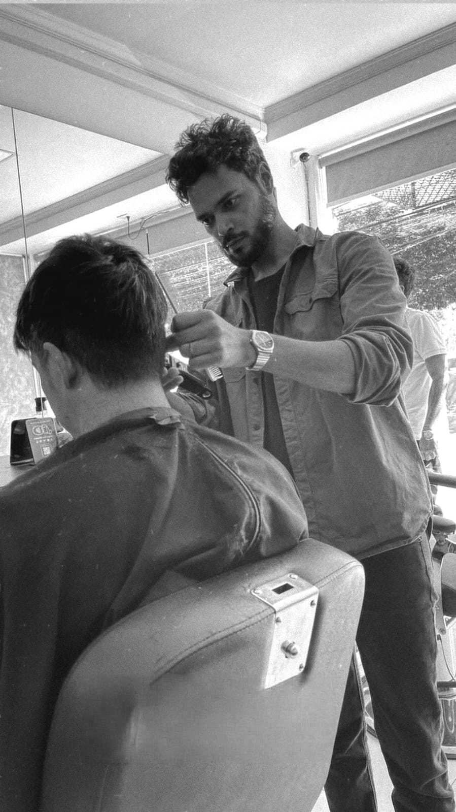 Cliente na cadeira durante atendimento