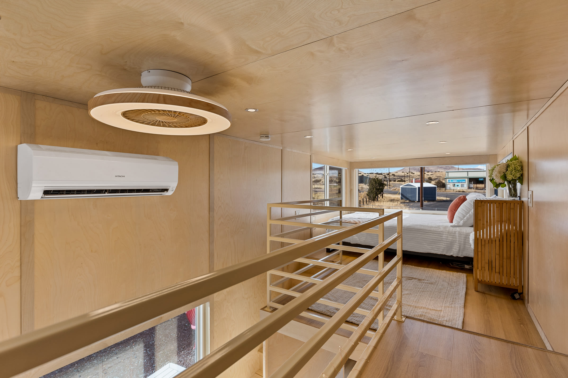 Catwalk leading to queen bed loft