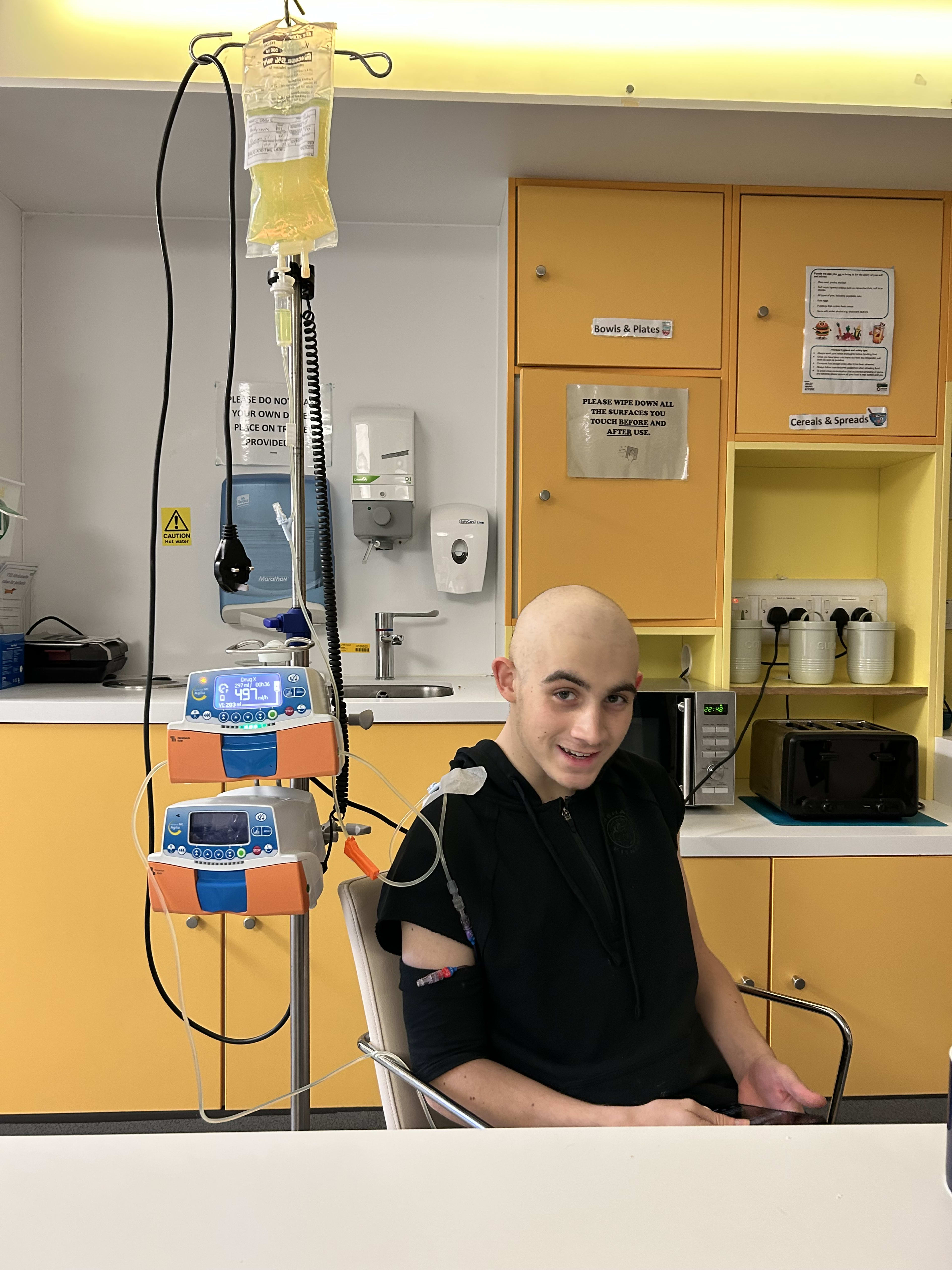 Charlie in hospital, IV drip, slight smile — Bristol TYA unit