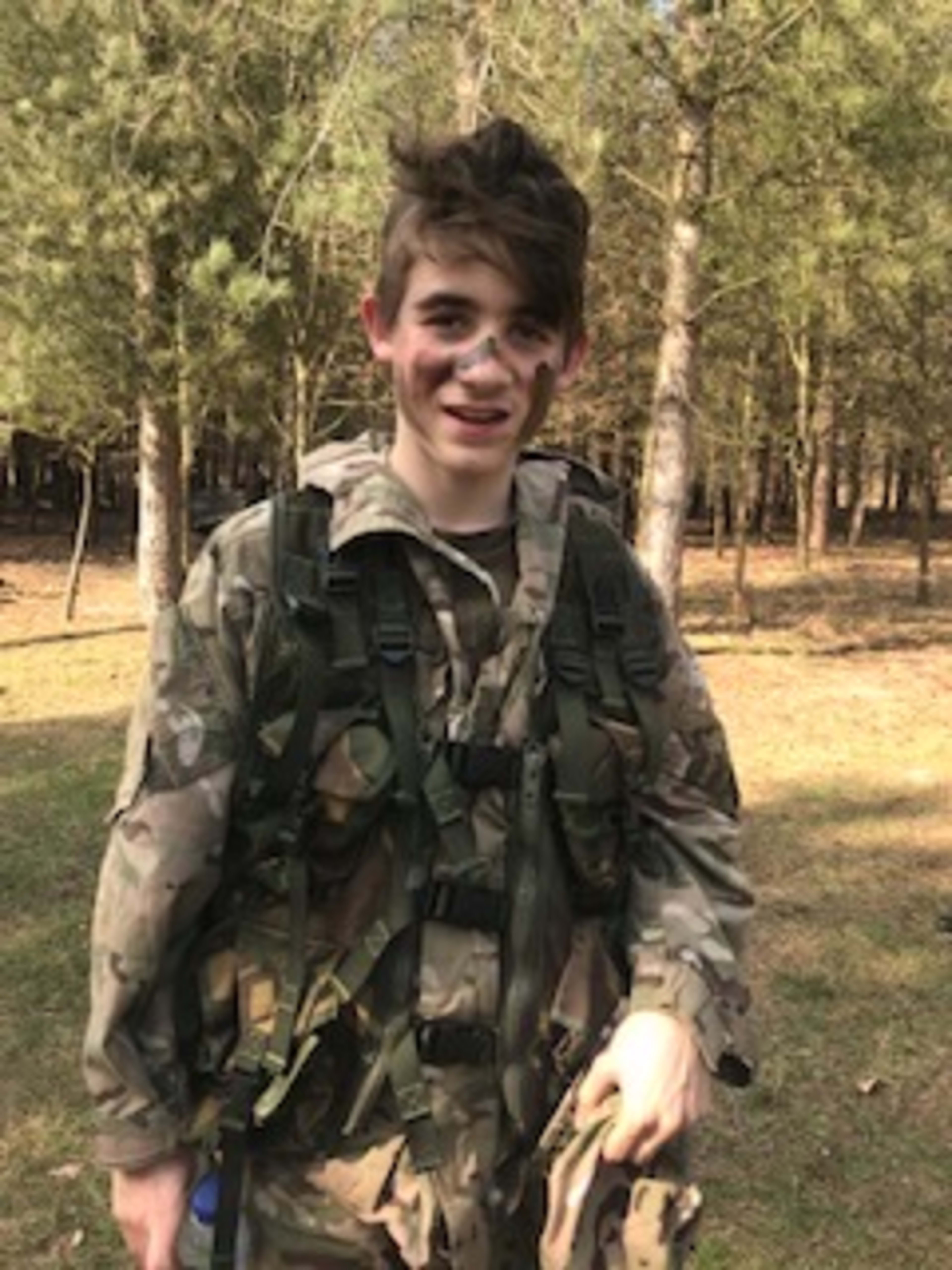 Charlie in military camo, cam cream, woodland setting