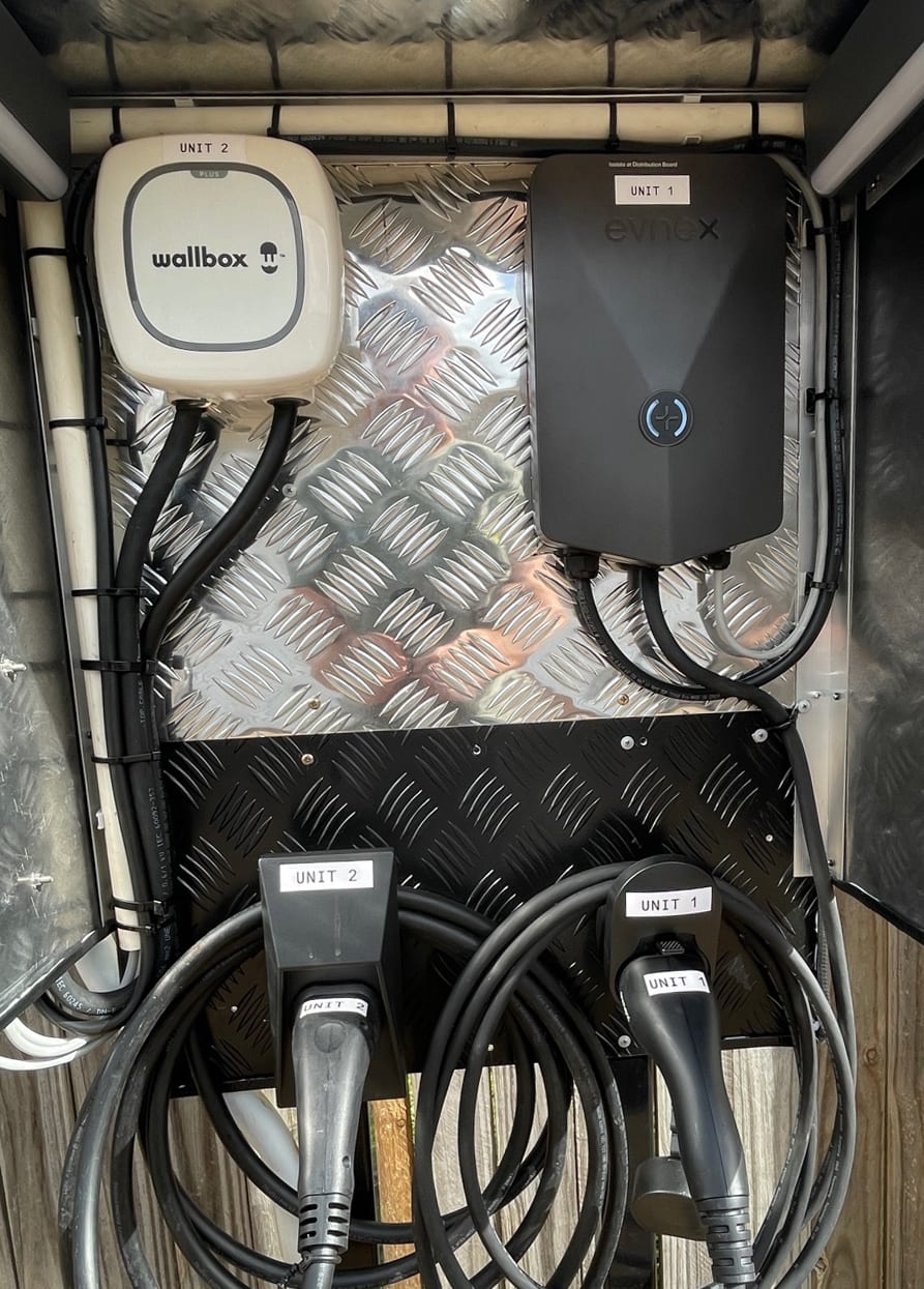 Wallbox Pulsar Plus and Evnex E2 Core EV chargers installed side-by-side at Vila Paus