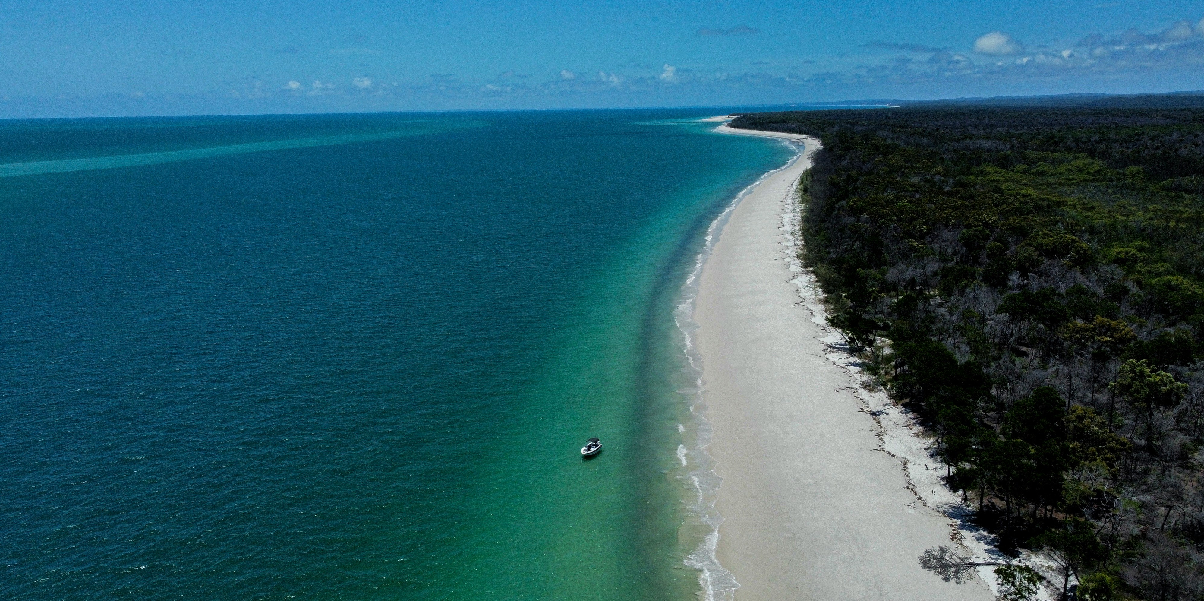 75 Mile Beach coastline on K'gari, part sandy highway and scenic drive