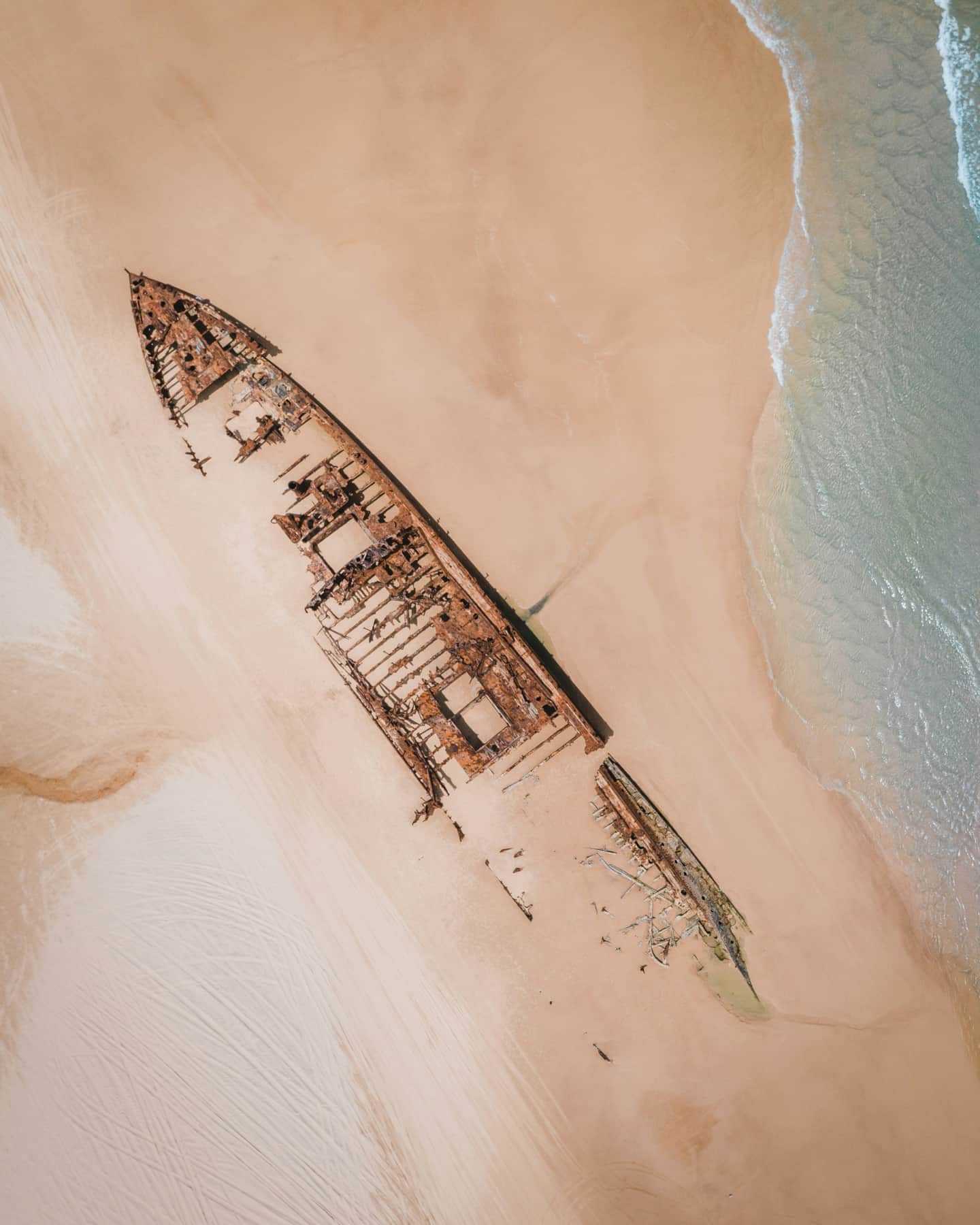 The rusting remains of the Maheno Shipwreck on 75 Mile Beach, K'gari