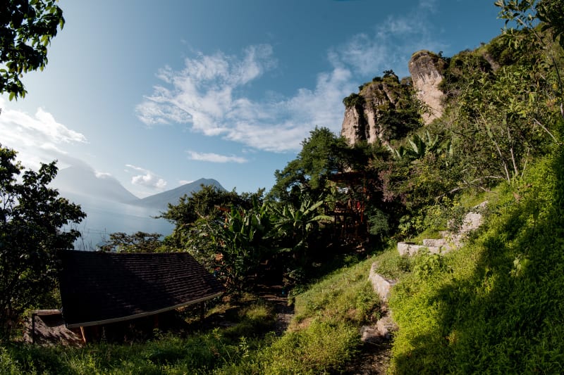 Terrace breakfast view at Fuego Atitlan with Lake Atitlan and volcanoes, Guatemala
