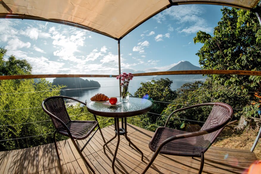 View from Fuego Atitlan eco hotel over Lake Atitlan and volcanoes, San Marcos La Laguna, Guatemala
