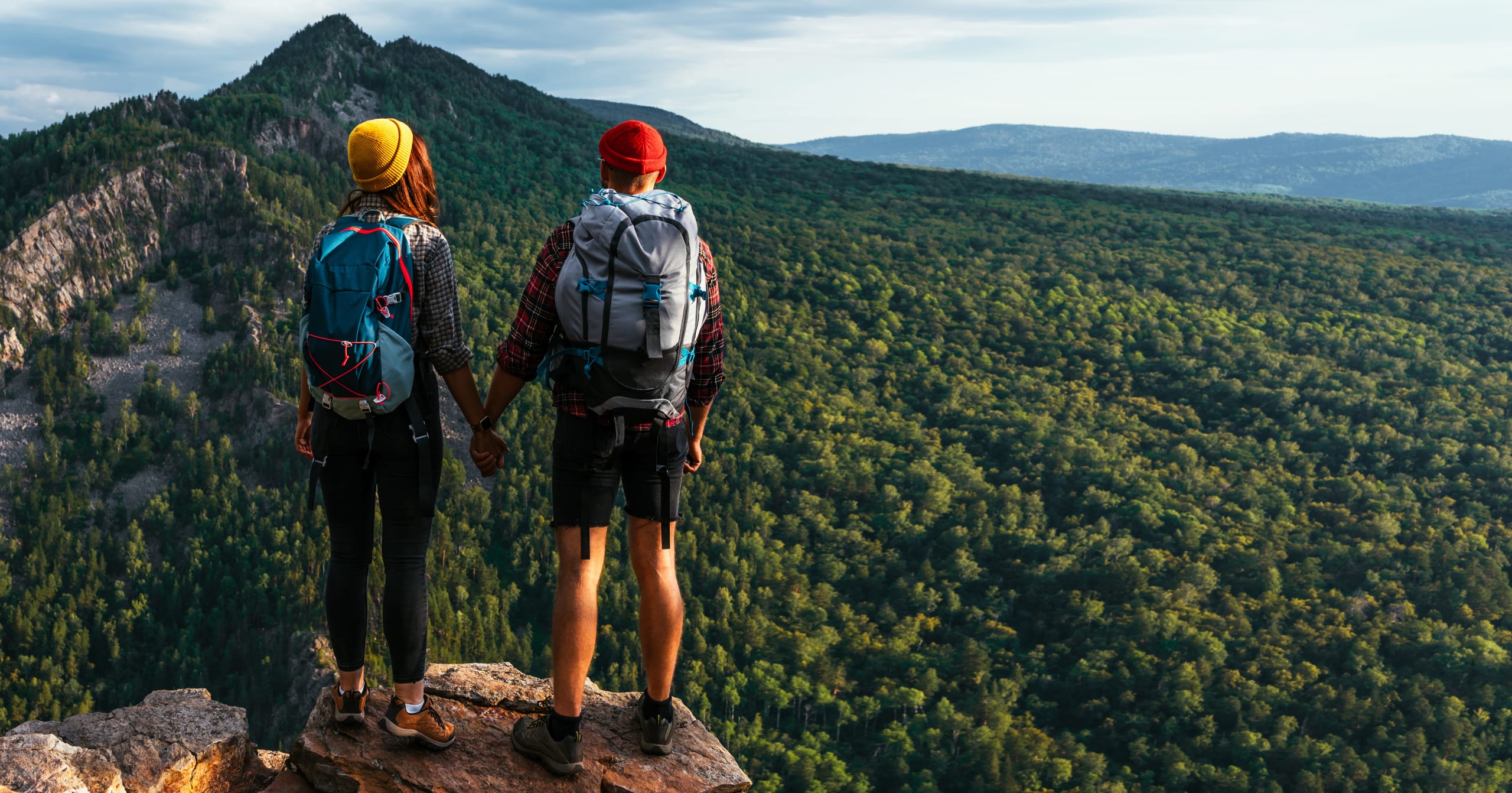 a-traveling-couple-in-the-mountains-a-man-and-a-w-2021-10-27-22-56-43-utc