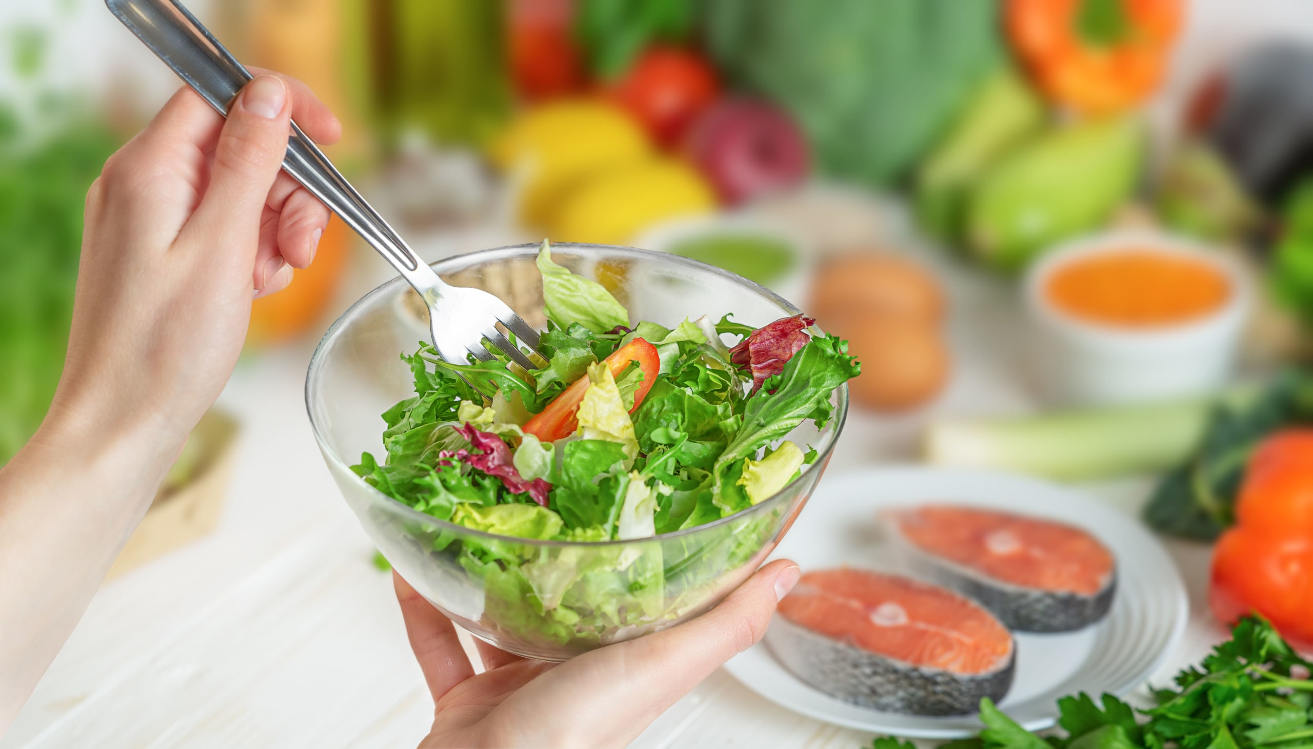 hands-holding-green-salad-bowl-health-care-and-we-2022-03-05-22-09-47-utc