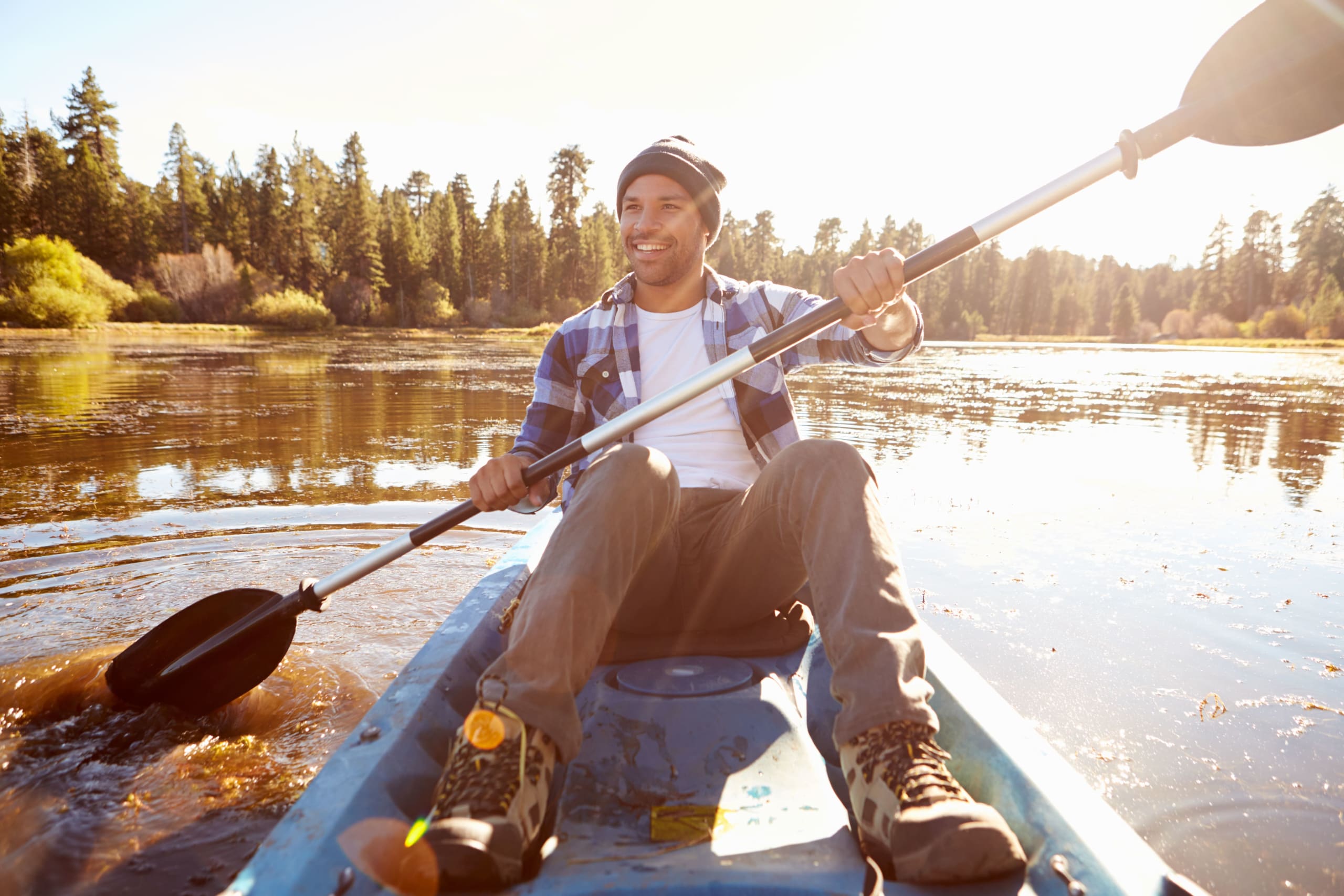 young-man-rowing-kayak-on-lake-2021-08-26-16-12-51-utc(1)