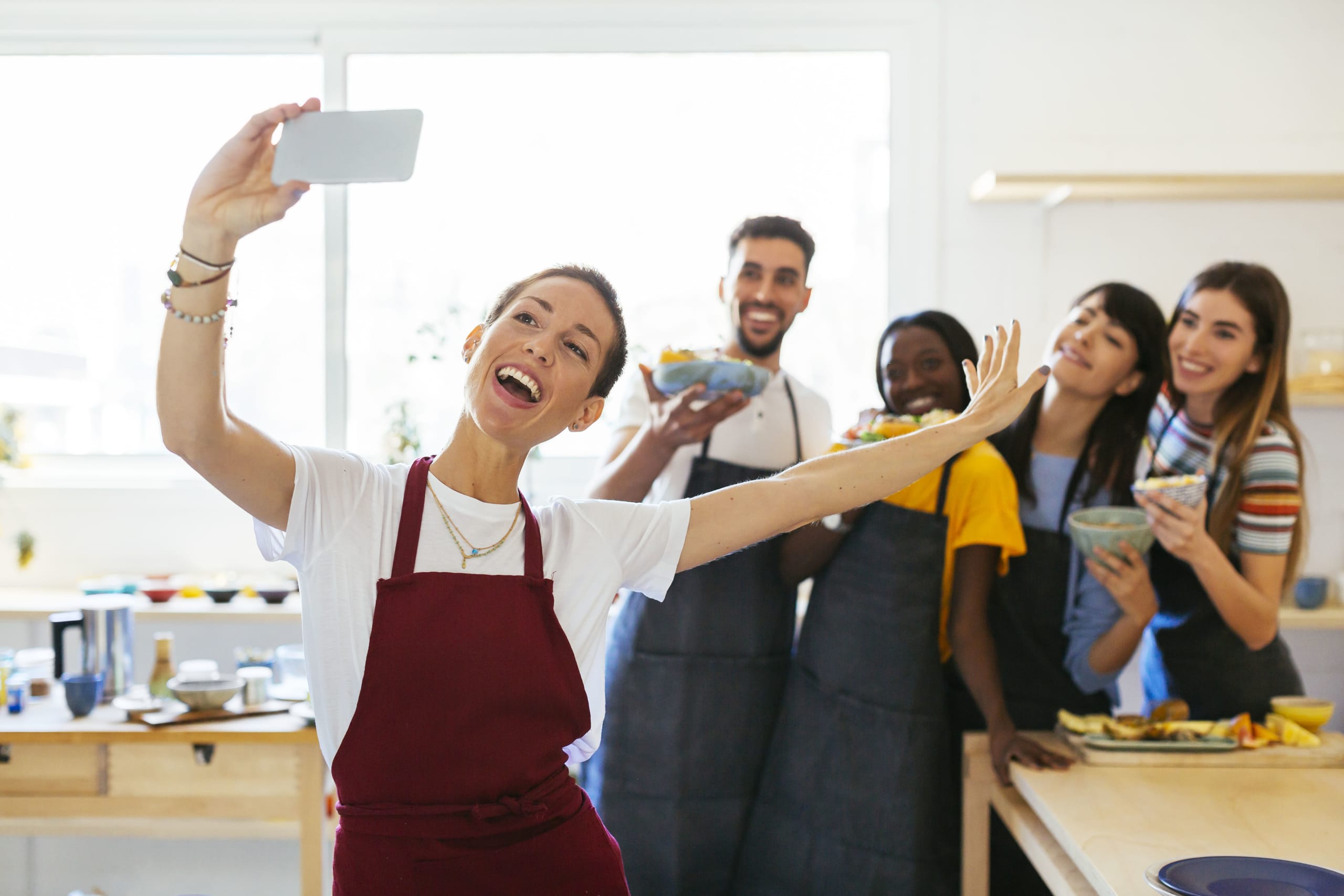 playful-instructor-taking-a-selfie-with-friends-in-2022-01-18-19-49-33-utc