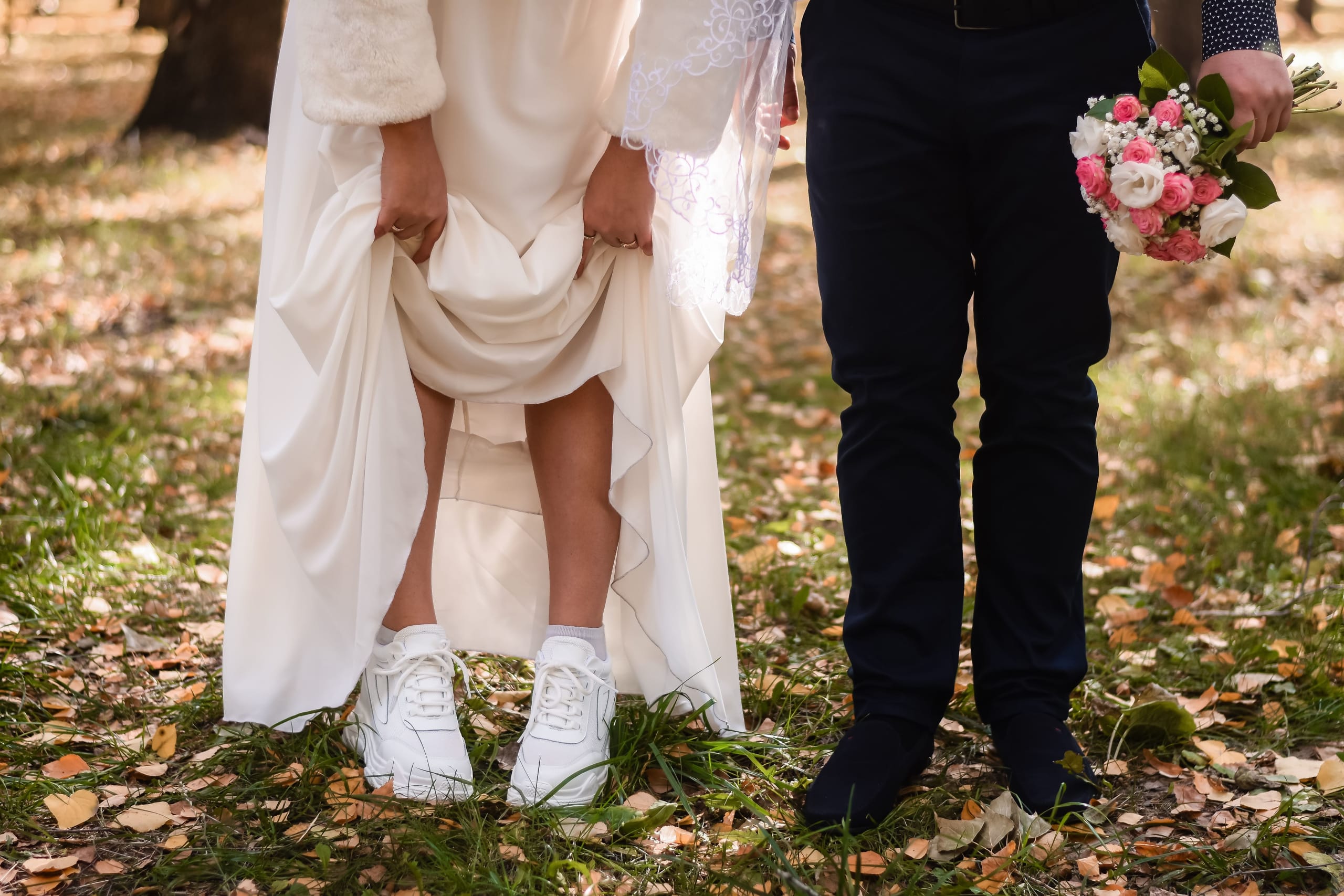 the-bride-lifted-her-skirt-showing-white-sneakers-2022-02-24-10-34-56-utc