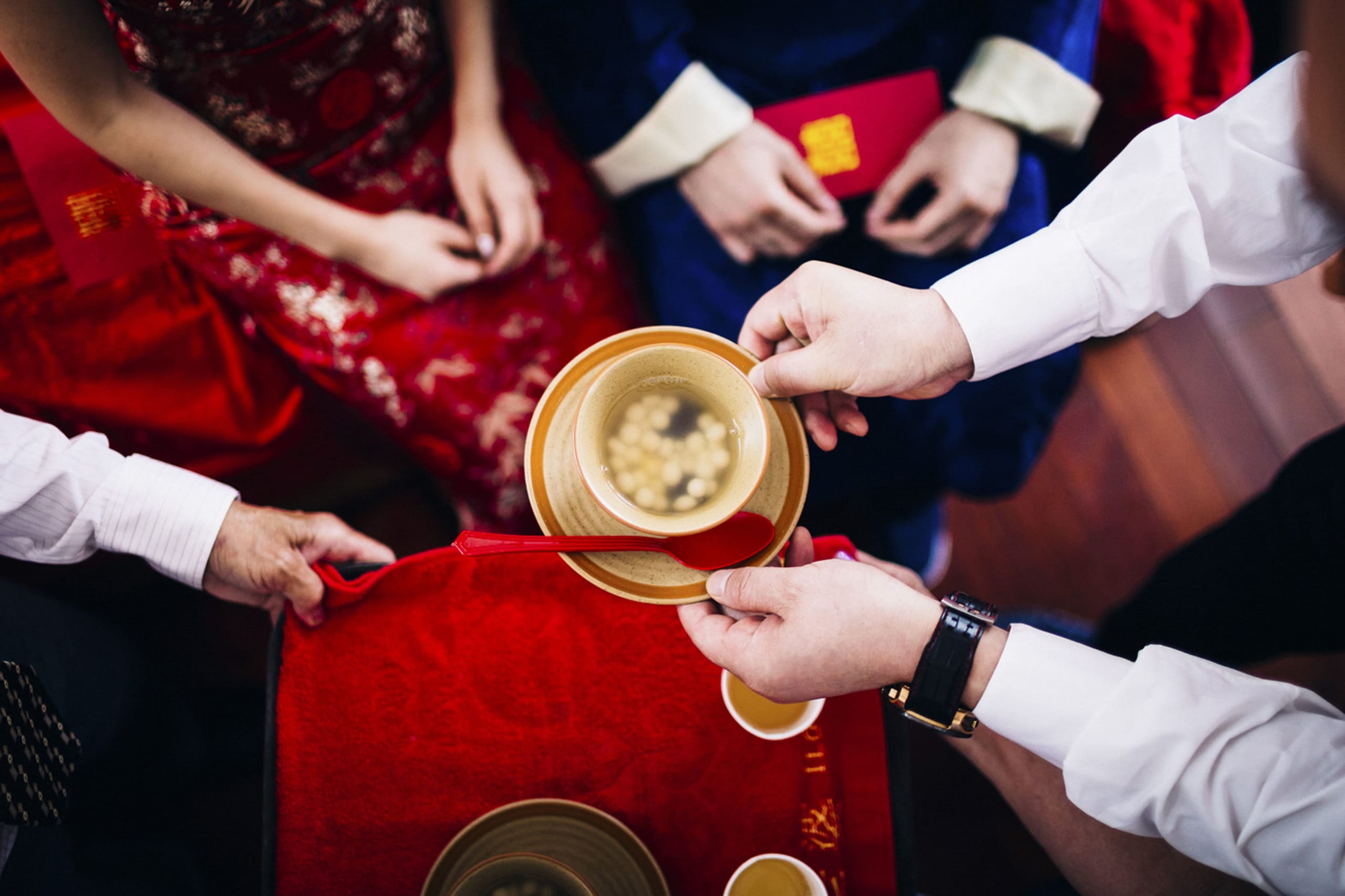 high-angle-close-up-of-a-ritual-at-a-chinese-weddi-2022-03-04-02-37-33-utc