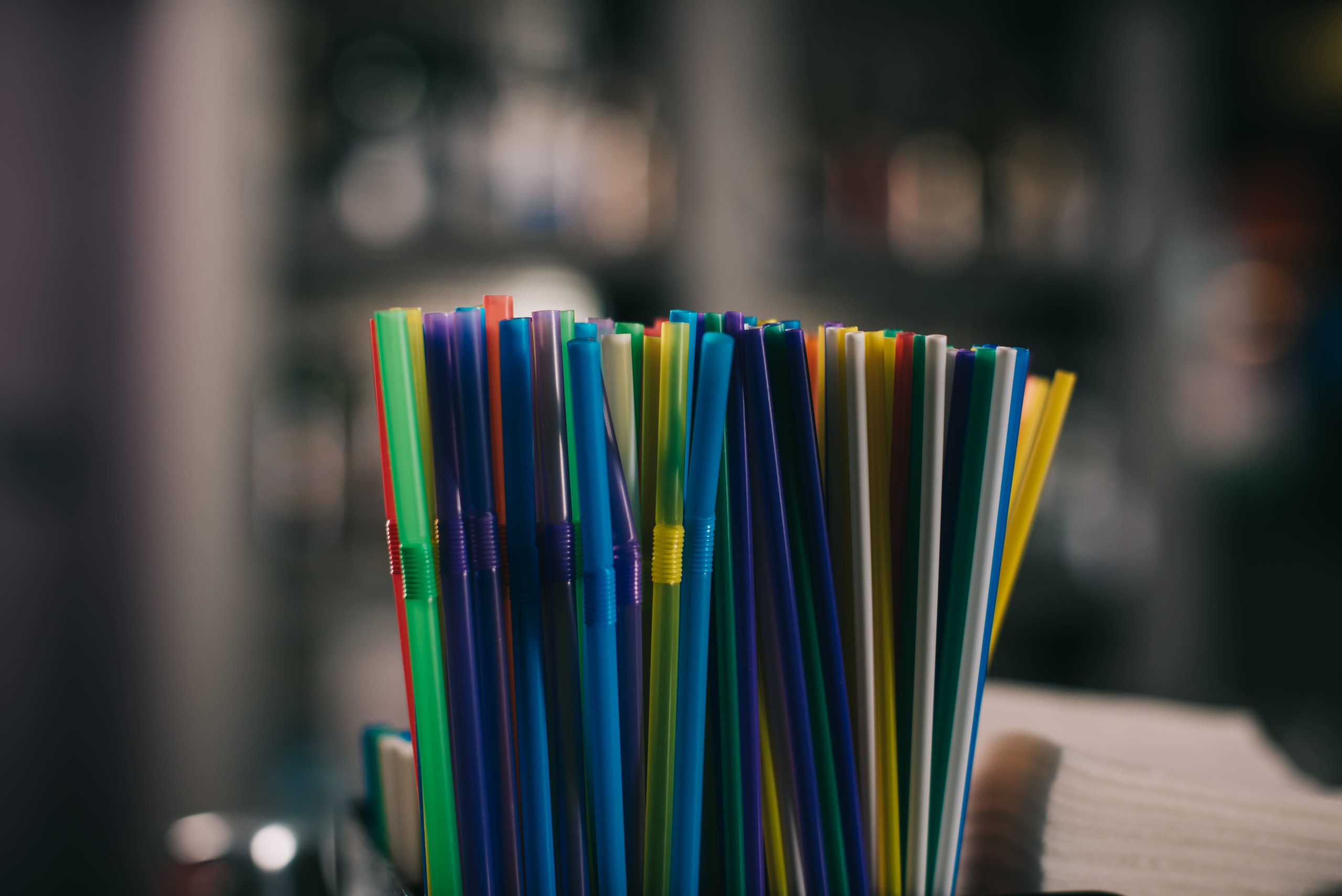 colored-plastic-straws-for-drinking-on-blurred-bac-2021-08-30-19-16-30-utc(1)