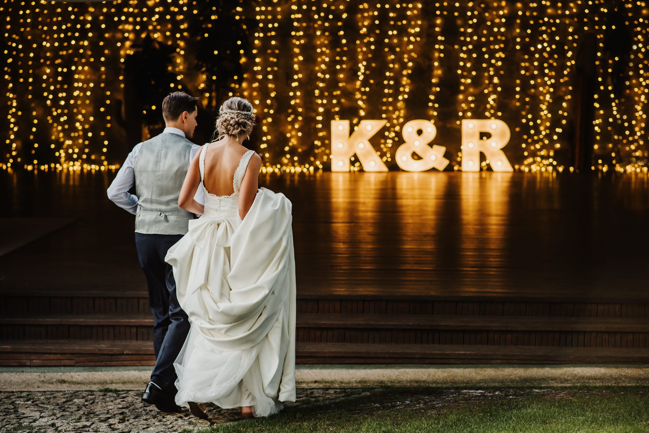 young-couple-at-their-wedding-walking-towards-the-2021-08-30-21-59-25-utc