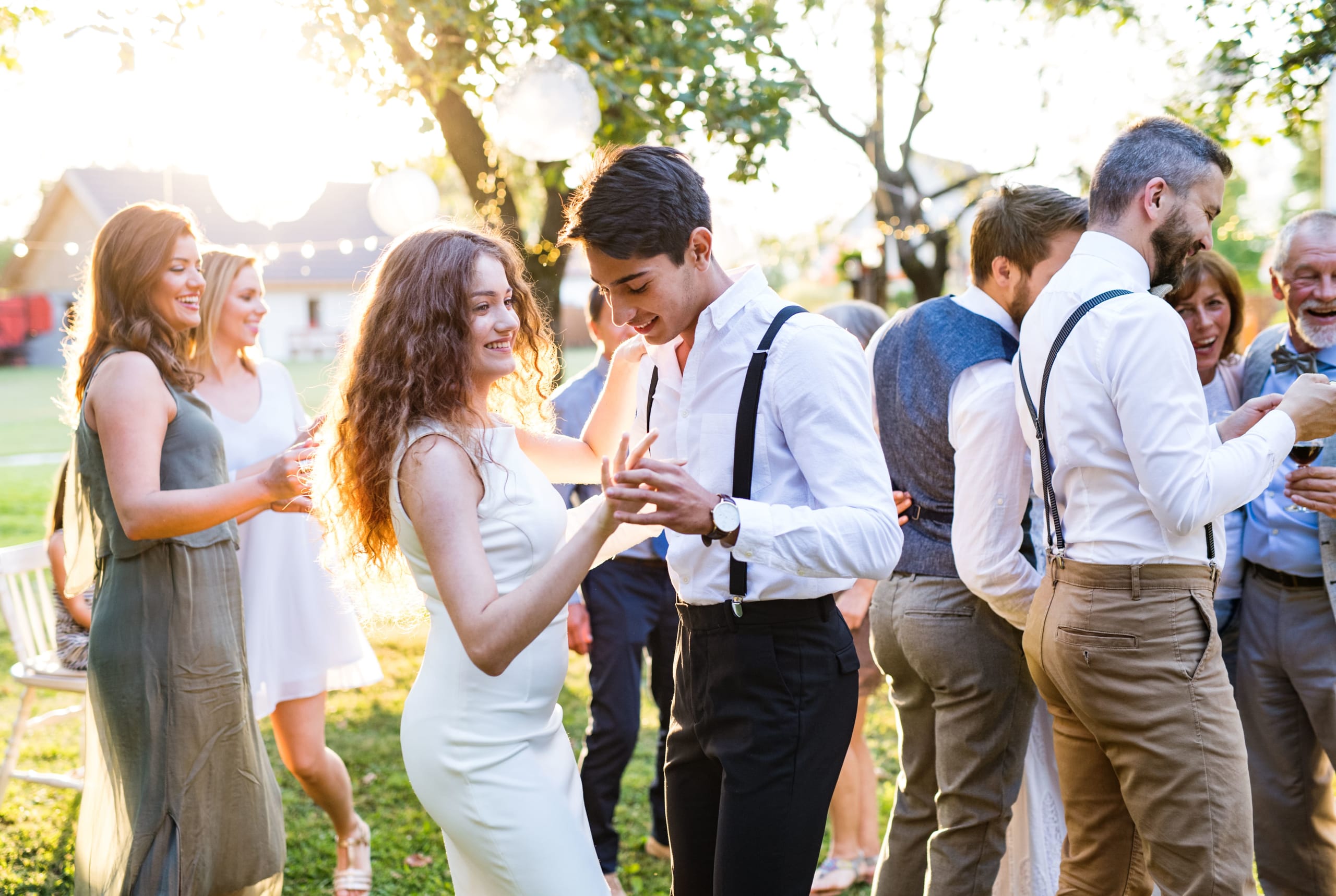 guests-dancing-at-wedding-reception-outside-in-the-2021-08-26-12-09-15-utc