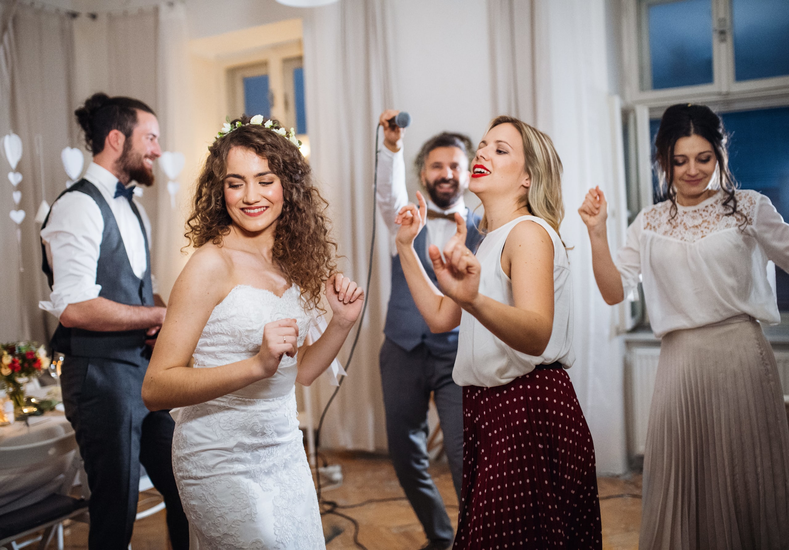 a-young-bride-with-other-guests-dancing-on-a-weddi-2021-08-26-12-09-23-utc (1)