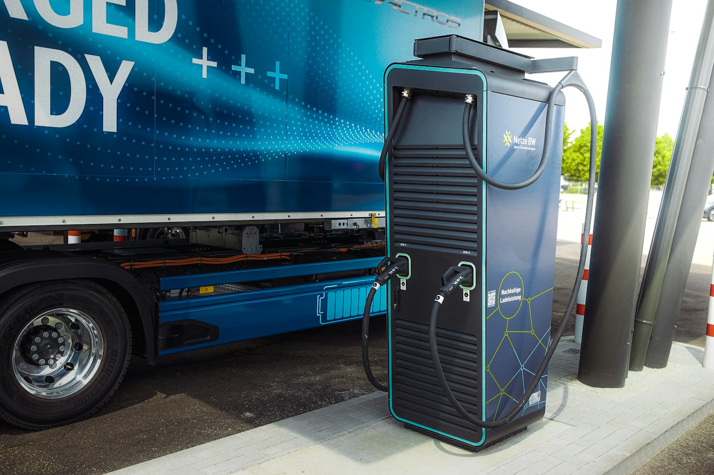 a blue truck with a door open