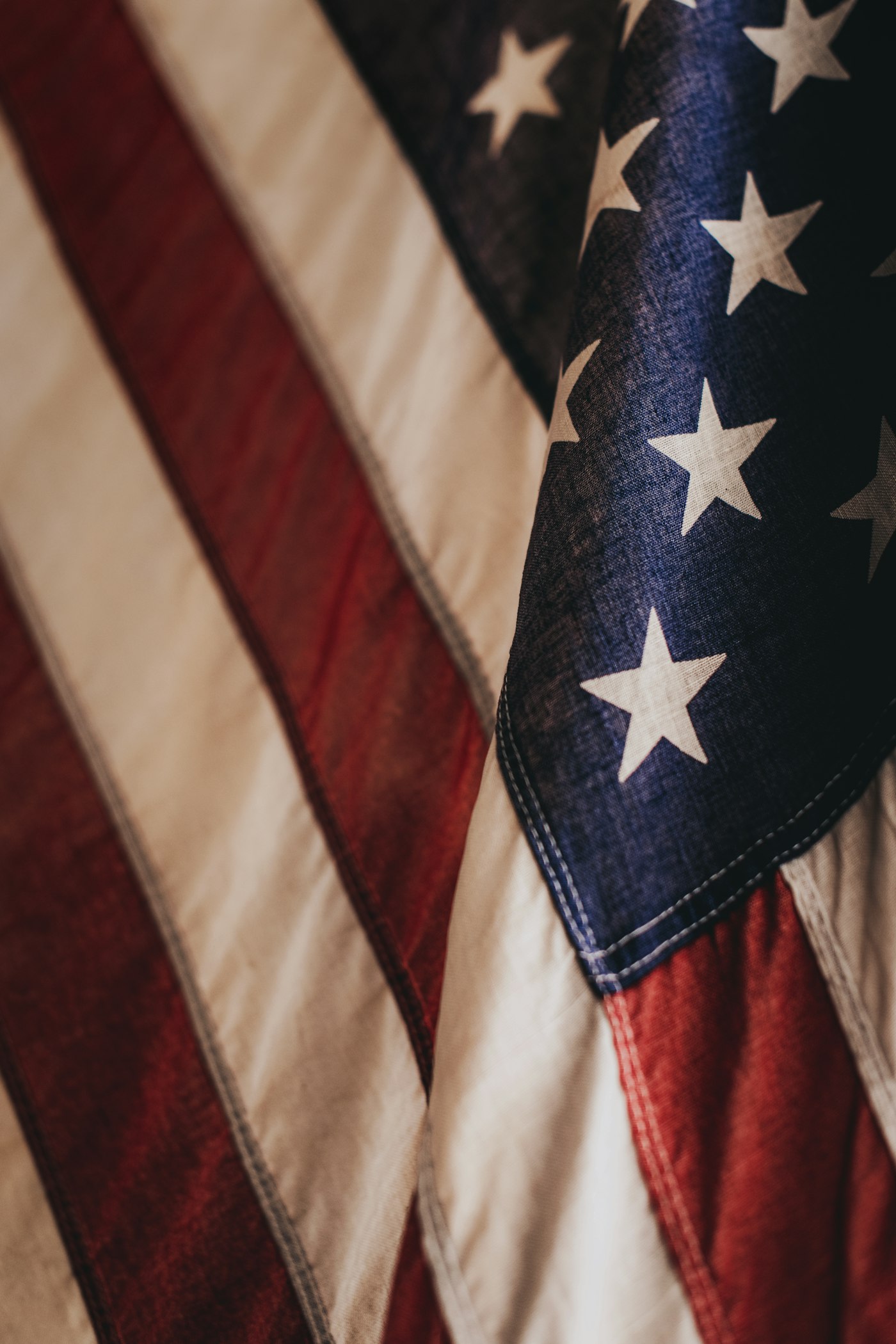A folded American flag with red and white stripes and white stars