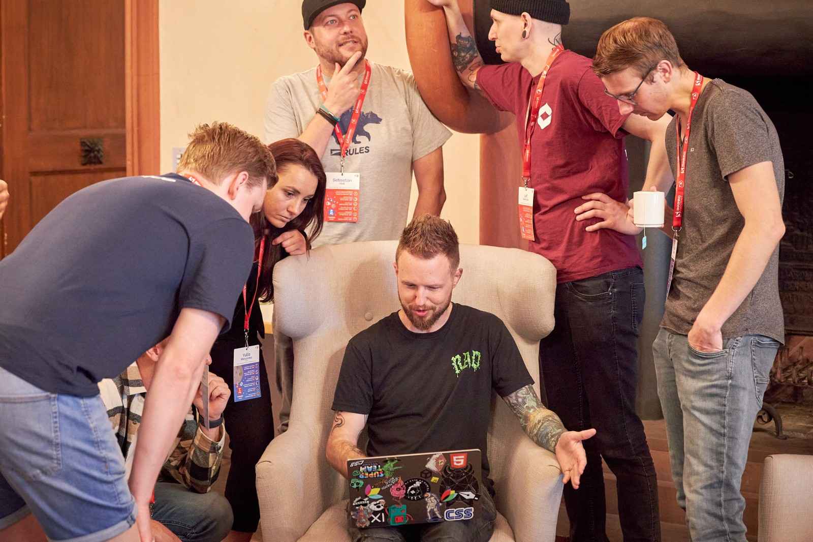 Me in a chair surrounded by interested developers