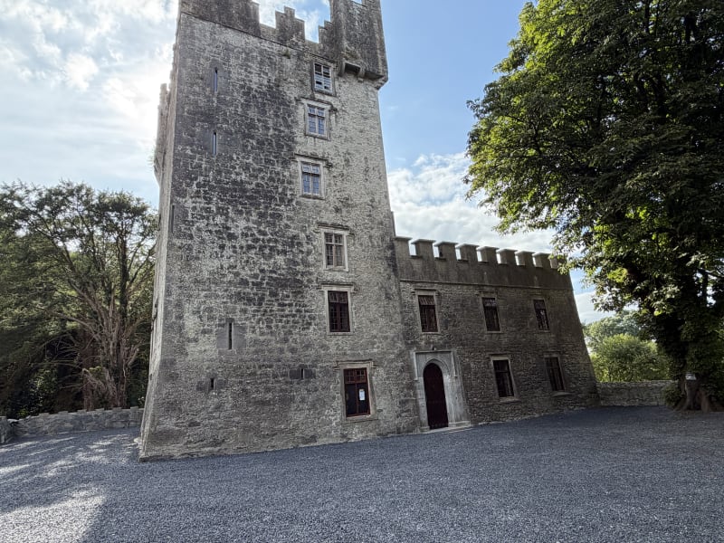 Castle Matrix tower and adjoining building beside a tree