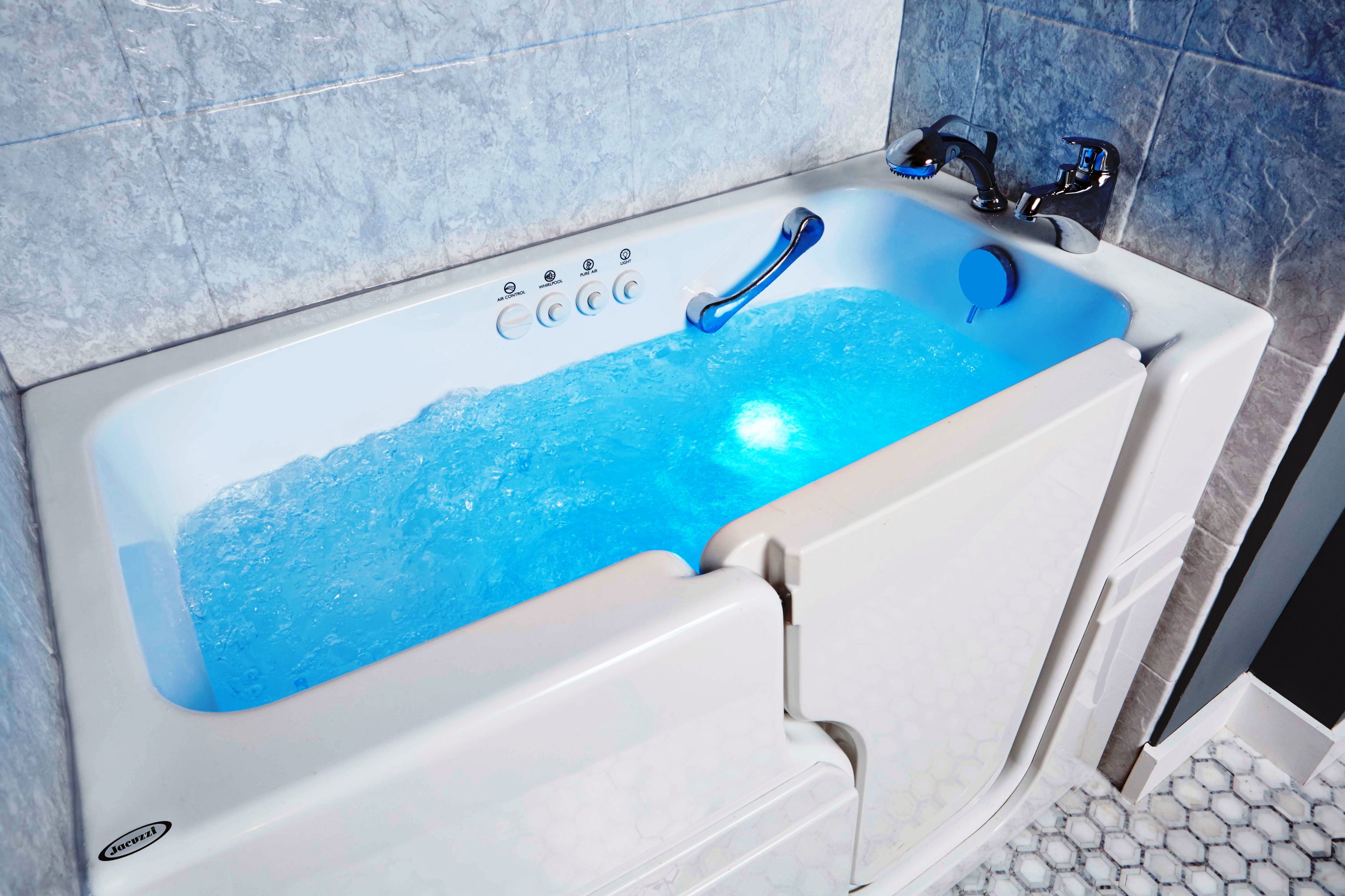 Accessible walk-in bathtub with built-in seating, grab bar, and blue water lighting, designed for safety, relaxation, and long-term usability in modern bathrooms.